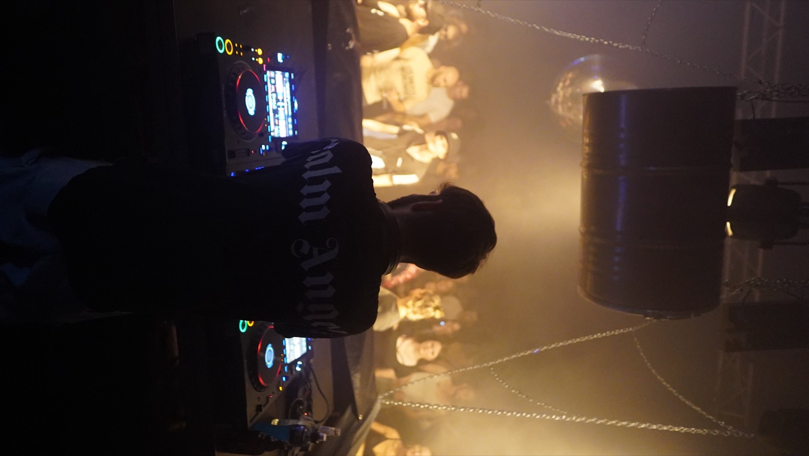 GIXSEPPE behind the decks in front of the crowd